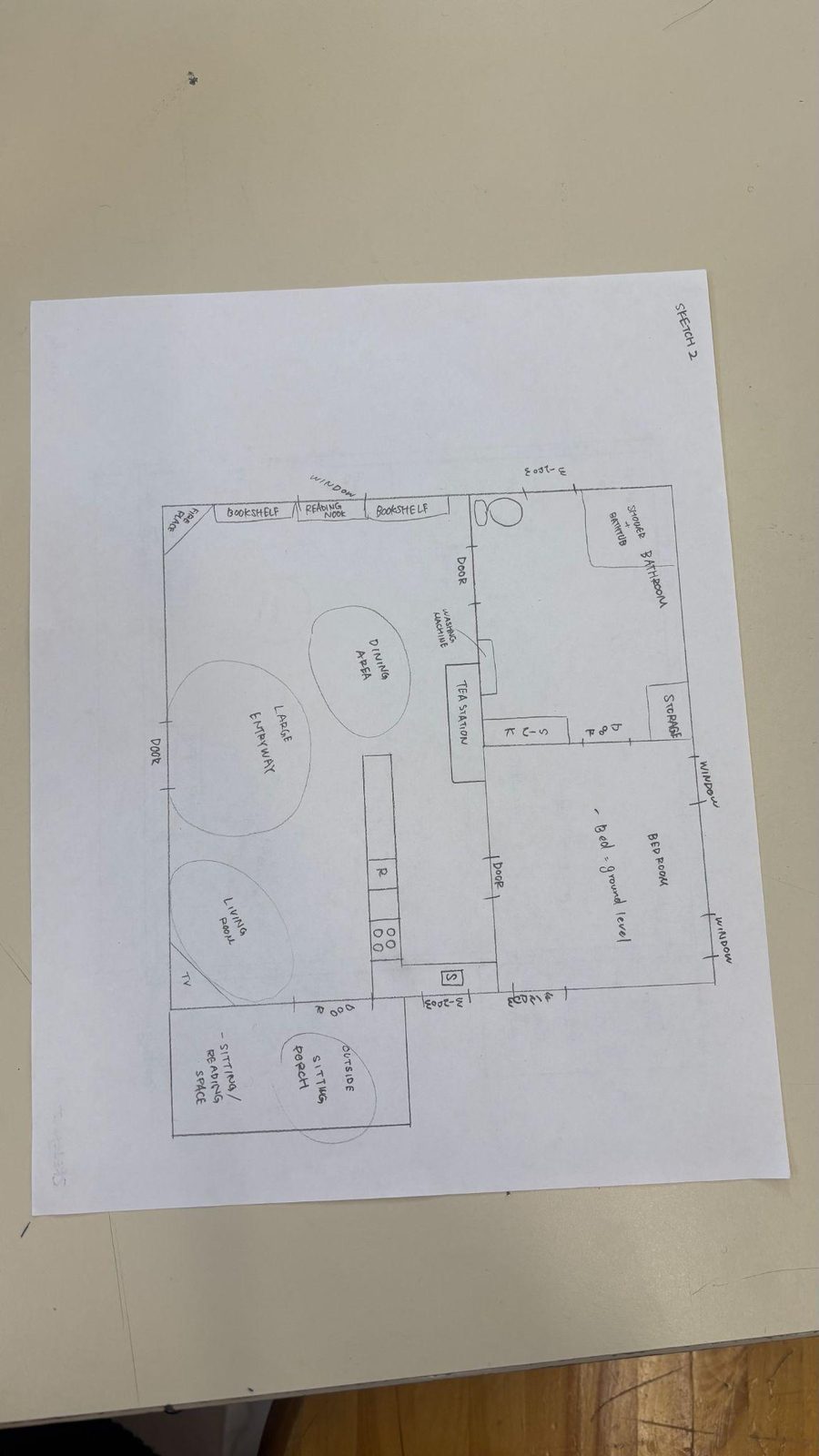 A pencil floor plan sketch with rooms labeled and bubbles marking the living, dining and entry zones